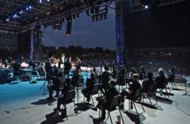 A backstage view of the performers and L-Acoustics loudspeaker arrays supplied by Firehouse Productions