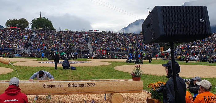 outdoor festival arena with seating and loudspeaker